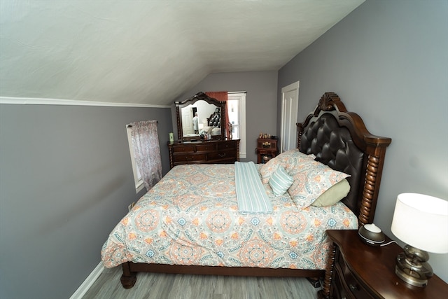 bedroom featuring vaulted ceiling