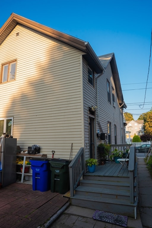 view of side of home with a deck