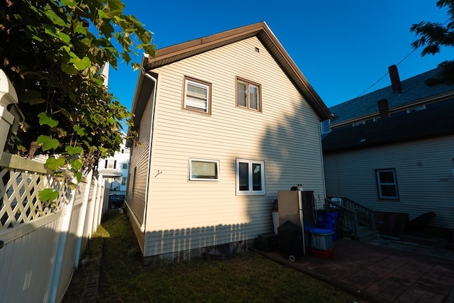 back of house with a patio