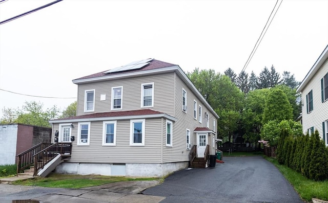 116-118 Lawrence St, Clinton, MA 01510 - view of front of property featuring solar panels and driveway