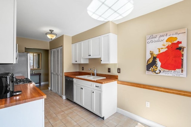 30 N Stone Ml Unit 1211, Dedham, MA 02026 - kitchen with a sink, white cabinets, stainless steel appliances, and butcher block countertops