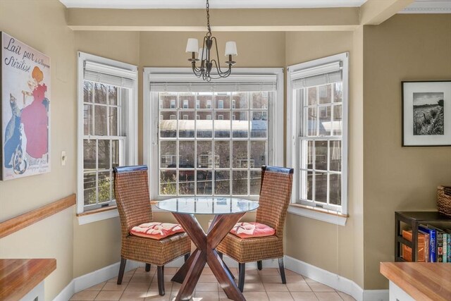 30 N Stone Ml Unit 1211, Dedham, MA 02026 - dining room featuring baseboards, light tile patterned flooring, and a chandelier