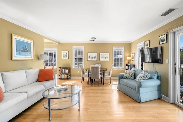30 N Stone Ml Unit 1211, Dedham, MA 02026 - living area with crown molding, baseboards, light wood-style floors, and visible vents