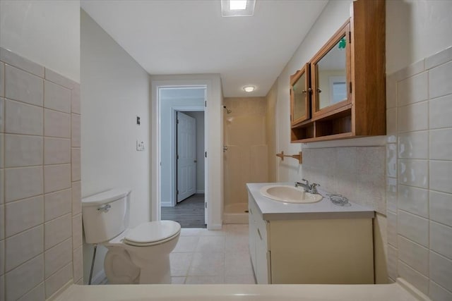 bathroom with tile patterned flooring, vanity, toilet, a shower stall, and visible vents