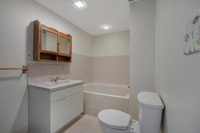 full bathroom with vanity, tile patterned floors, a tub, and toilet