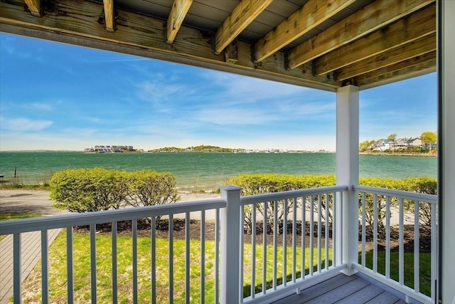 balcony featuring a water view