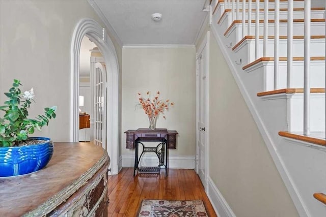 57 Highland St, Holden, MA 01520 - doorway to outside with hardwood / wood-style floors, arched walkways, crown molding, and stairway