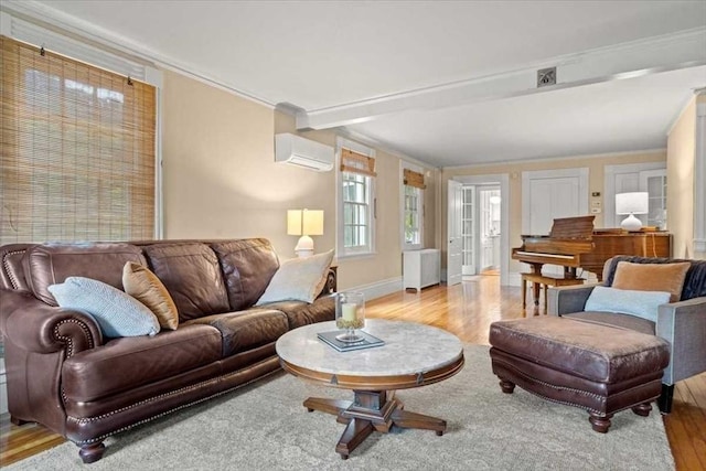 57 Highland St, Holden, MA 01520 - living area featuring wood finished floors, ornamental molding, a wall mounted air conditioner, baseboards, and radiator