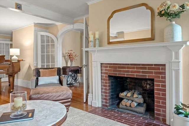 57 Highland St, Holden, MA 01520 - living area with a fireplace with flush hearth, crown molding, and wood finished floors