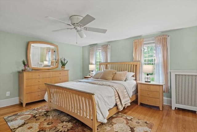 57 Highland St, Holden, MA 01520 - bedroom featuring multiple windows, light wood finished floors, baseboards, and a ceiling fan