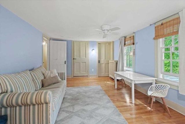 57 Highland St, Holden, MA 01520 - living room with light wood-type flooring, ceiling fan, and baseboards
