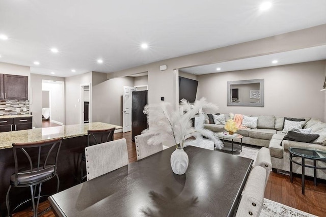 dining space featuring dark hardwood / wood-style floors