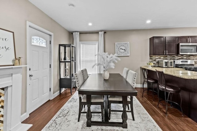 dining room with dark wood-type flooring