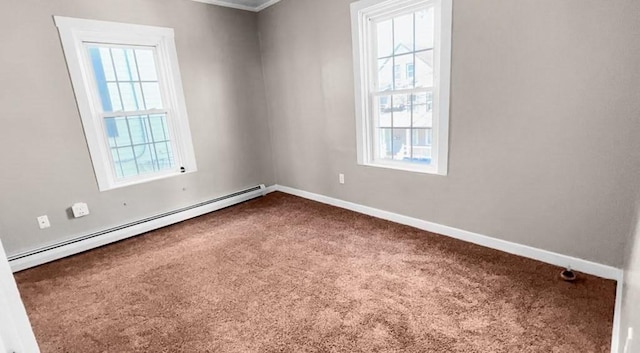 carpeted empty room with baseboard heating