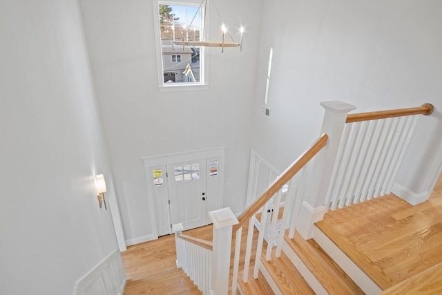 staircase featuring wood-type flooring