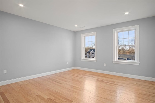 spare room with light wood-type flooring