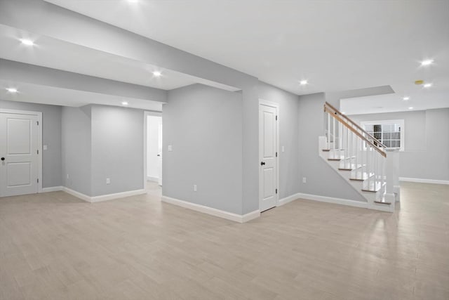 basement featuring light hardwood / wood-style flooring