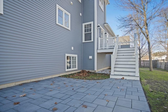 back of house featuring a patio and a wooden deck