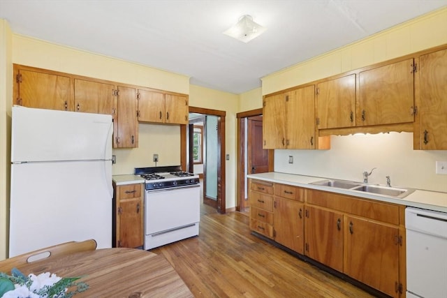 26 W Walnut St, Milford, MA 01757 - kitchen with a sink, light wood finished floors, white appliances, and light countertops