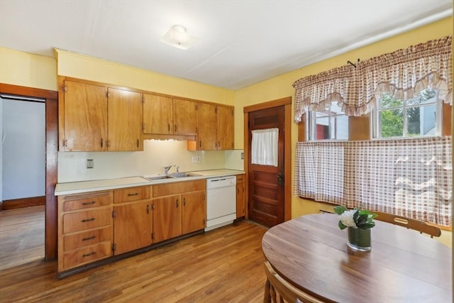 26 W Walnut St, Milford, MA 01757 - kitchen featuring white dishwasher, a sink, wood finished floors, brown cabinets, and light countertops