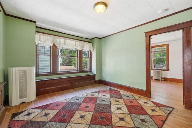 26 W Walnut St, Milford, MA 01757 - unfurnished room with ornamental molding, radiator, baseboards, and wood-type flooring