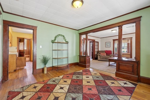 26 W Walnut St, Milford, MA 01757 - entrance foyer with crown molding, hardwood / wood-style flooring, and ornate columns