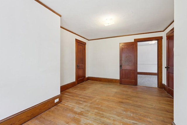 26 W Walnut St, Milford, MA 01757 - unfurnished room featuring ornamental molding, baseboards, and light wood-type flooring