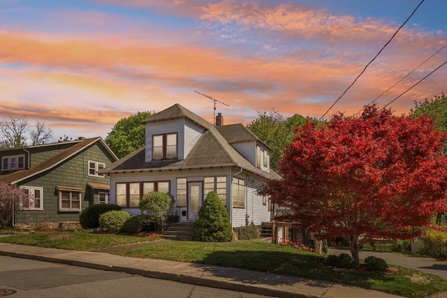 26 W Walnut St, Milford, MA 01757 - bungalow-style house with a front lawn and a chimney