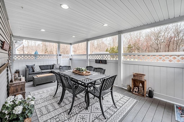 sunroom / solarium featuring wooden ceiling