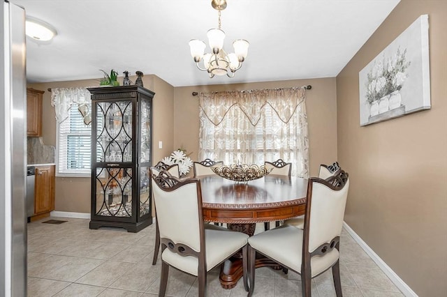 14 Watson St Unit 4, Lowell, MA 01852 - dining space featuring a chandelier and light tile patterned floors