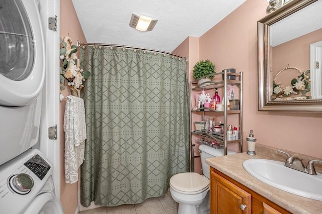 14 Watson St Unit 4, Lowell, MA 01852 - bathroom featuring estacked washer and dryer, vanity, tile patterned flooring, and a shower with shower curtain