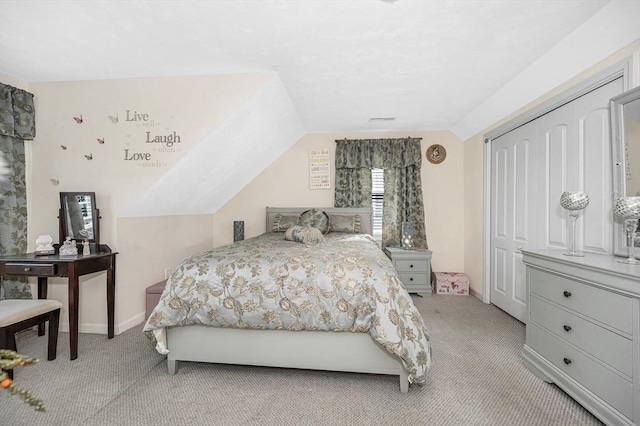 14 Watson St Unit 4, Lowell, MA 01852 - bedroom with light carpet, vaulted ceiling, and a closet