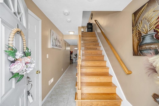 14 Watson St Unit 4, Lowell, MA 01852 - stairway with tile patterned floors and baseboards