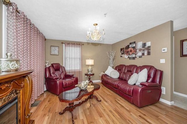 14 Watson St Unit 4, Lowell, MA 01852 - living room with a chandelier and wood finished floors