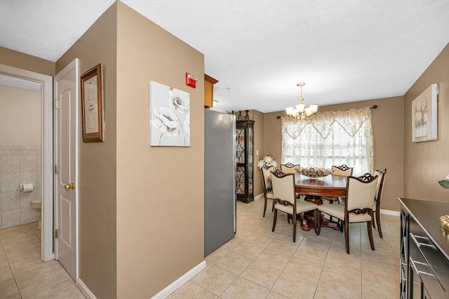 14 Watson St Unit 4, Lowell, MA 01852 - dining room with a chandelier and light tile patterned floors