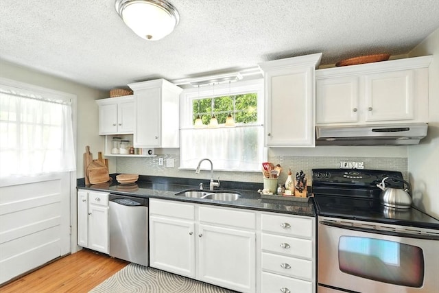 2480 Wilbraham Rd, Springfield, MA 01129 - kitchen featuring stainless steel appliances, extractor fan, a sink, white cabinets, and a textured ceiling