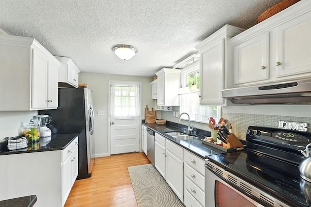 2480 Wilbraham Rd, Springfield, MA 01129 - kitchen with appliances with stainless steel finishes, exhaust hood, a sink, white cabinetry, and dark countertops