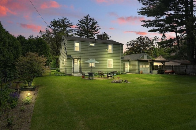 2480 Wilbraham Rd, Springfield, MA 01129 - rear view of property with a chimney and an outdoor fire pit