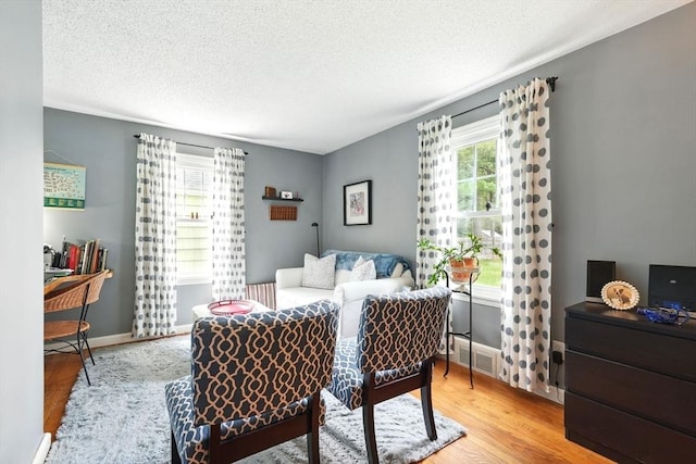 2480 Wilbraham Rd, Springfield, MA 01129 - bedroom featuring wood finished floors, a textured ceiling, and baseboards