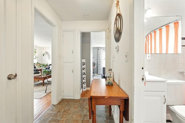 2480 Wilbraham Rd, Springfield, MA 01129 - entryway with a textured ceiling and stone finish flooring