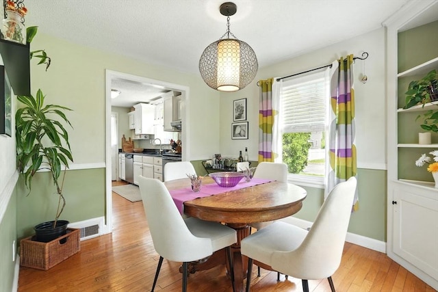 2480 Wilbraham Rd, Springfield, MA 01129 - dining area featuring light wood-type flooring and baseboards