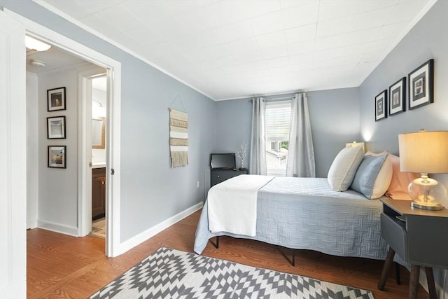 2480 Wilbraham Rd, Springfield, MA 01129 - bedroom featuring ornamental molding, wood finished floors, ensuite bath, and baseboards