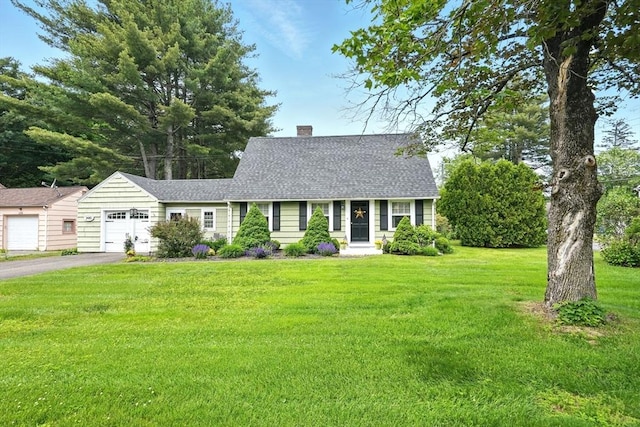 2480 Wilbraham Rd, Springfield, MA 01129 - new england style home with asphalt driveway, a garage, a chimney, a front yard, and a shingled roof