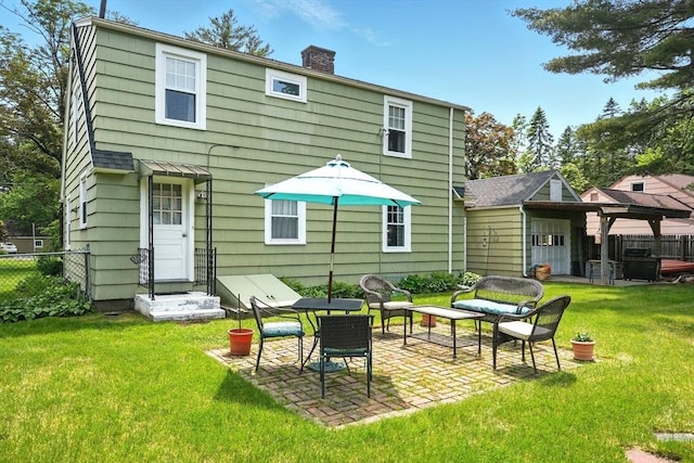 2480 Wilbraham Rd, Springfield, MA 01129 - back of house with a patio area and a chimney