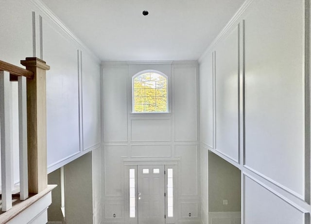 entrance foyer featuring a decorative wall