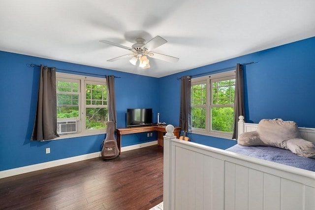 32 Witham St Unit B, Gloucester, MA 01930 - bedroom with multiple windows, dark wood-style floors, baseboards, and ceiling fan