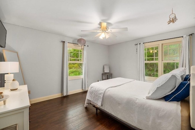 32 Witham St Unit B, Gloucester, MA 01930 - bedroom with multiple windows, baseboards, dark wood finished floors, and a ceiling fan