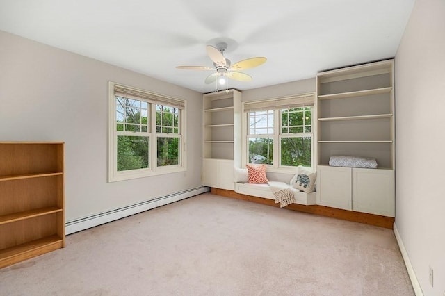 32 Witham St Unit B, Gloucester, MA 01930 - sitting room with baseboard heating, carpet, plenty of natural light, and ceiling fan
