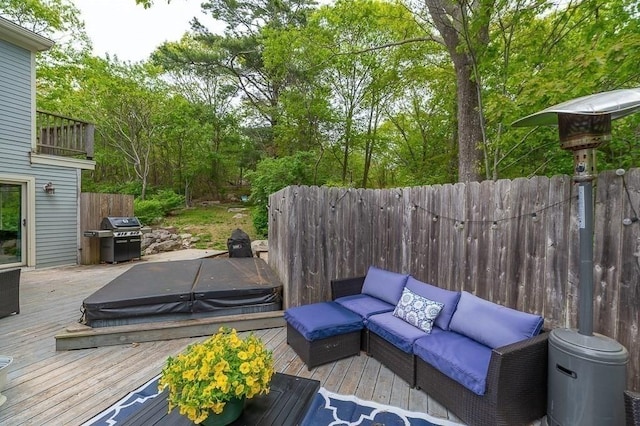 32 Witham St Unit B, Gloucester, MA 01930 - wooden deck featuring a covered hot tub, a grill, and outdoor lounge area