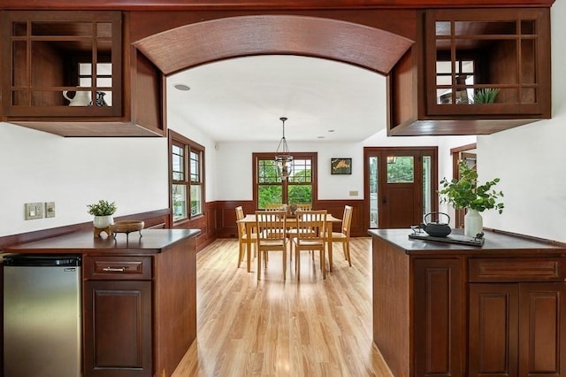 32 Witham St Unit B, Gloucester, MA 01930 - dining space featuring a wainscoted wall and light wood-style floors